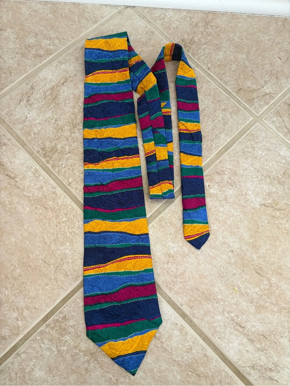 Coogi multicolor 100% silk necktie featuring a textured geometric pattern
